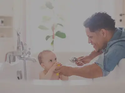 man giving his baby a bath